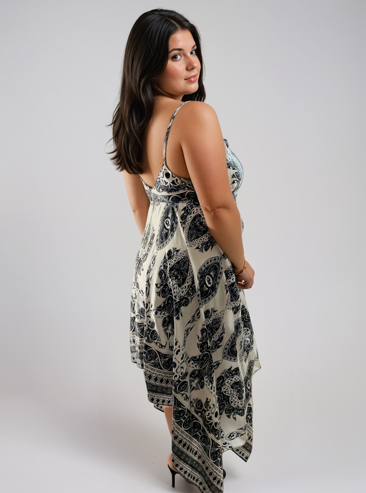 Gaia Butterfly Silk Dress in Noir Paisley print featuring black and white paisley motifs, adjustable straps, and flowing handkerchief hem