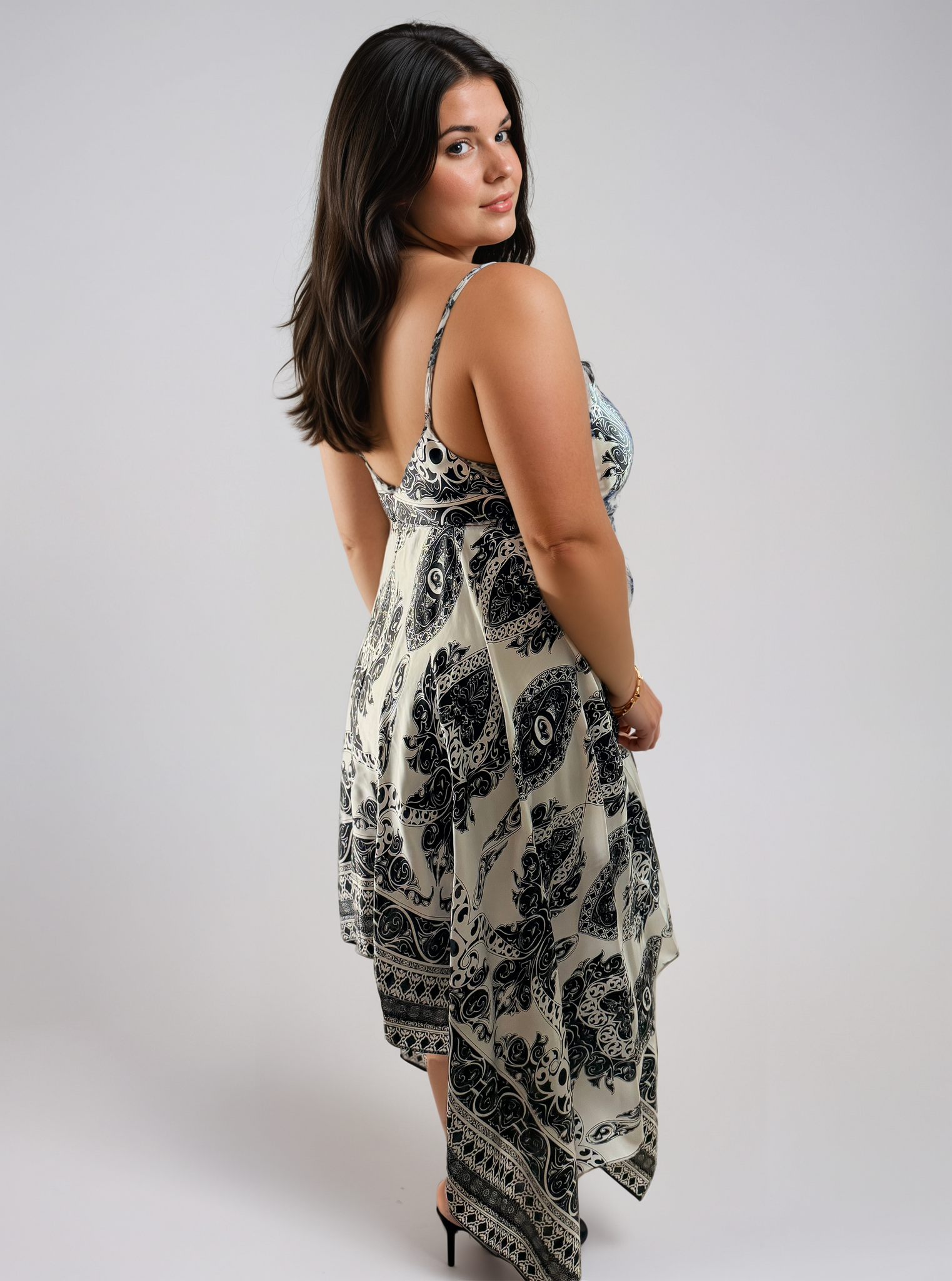 Gaia Butterfly Silk Dress in Noir Paisley print featuring black and white paisley motifs, adjustable straps, and flowing handkerchief hem