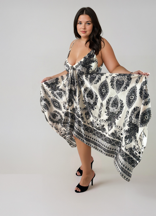 Gaia Butterfly Silk Dress in Noir Paisley print featuring black and white paisley motifs, adjustable straps, and flowing handkerchief hem